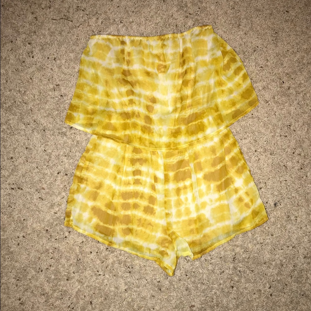 Size small yellow and white tie dye romper.
